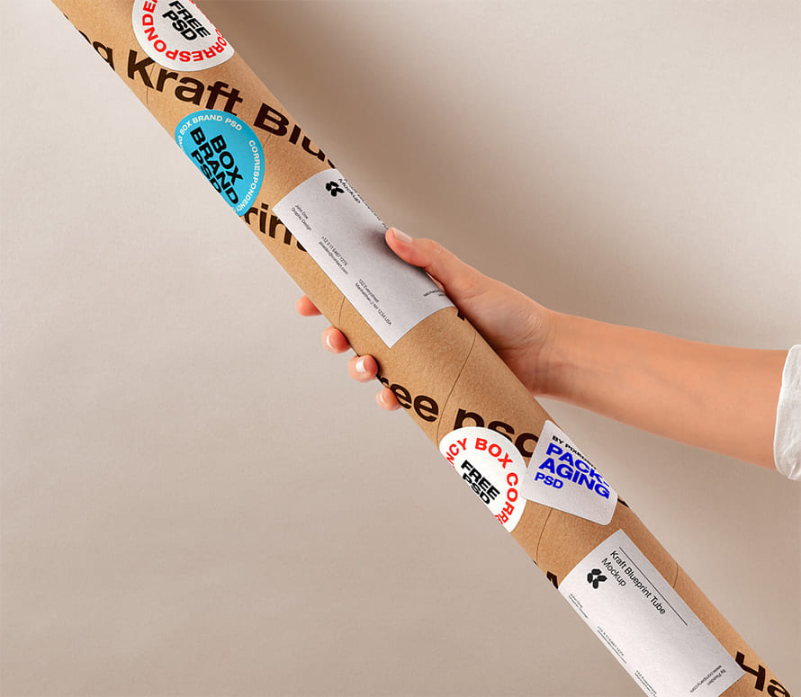Free Hand Holding Kraft Tube Psd Mockup